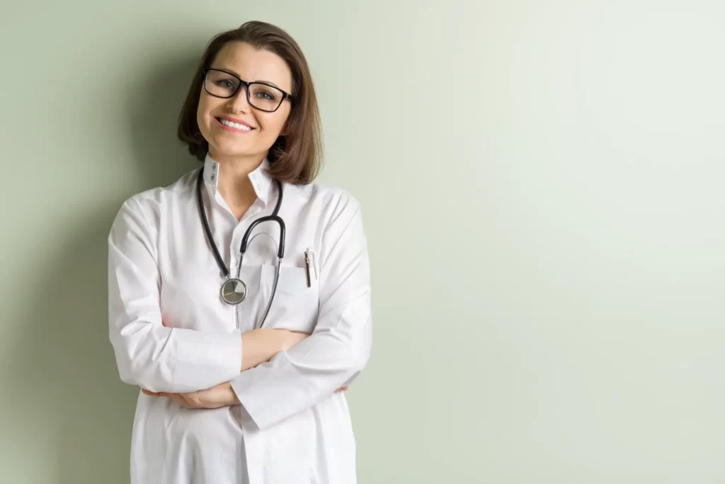 Licensed provider smiling in a clinical setting